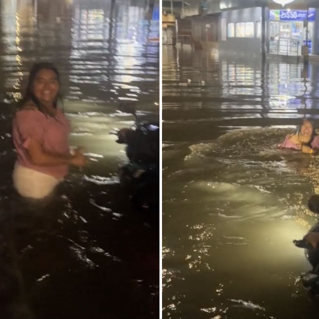 Mujer nada en calle inundada de Veracruz