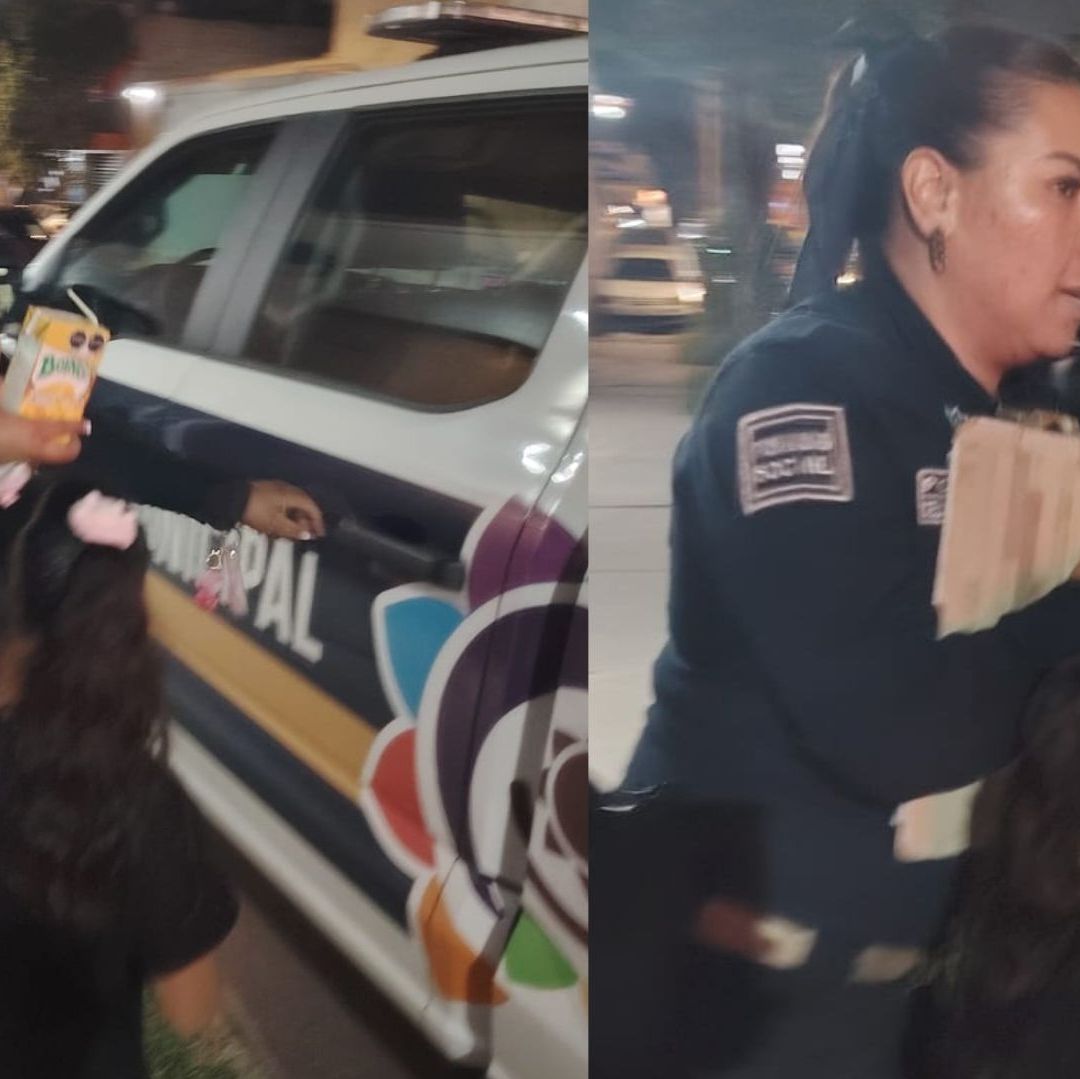 Una policía sabre la puerta de una patrulla para resguardar a una niña.