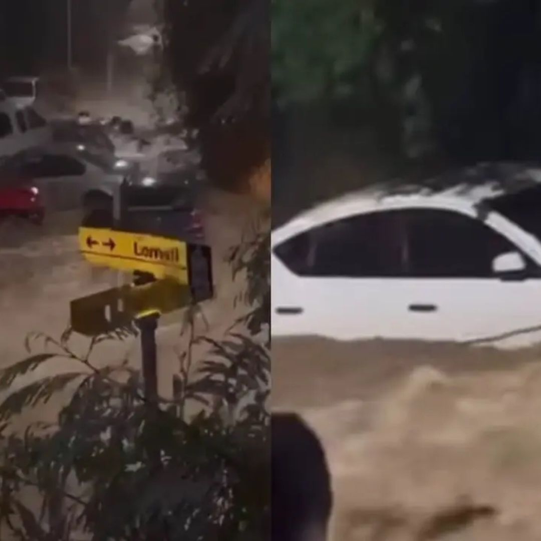 Carros arrastrados por corriente de lluvia en Santiago