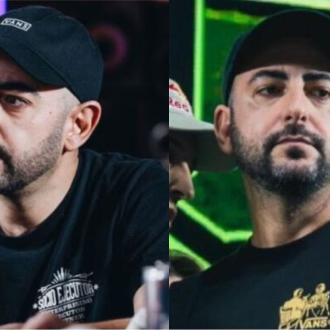 Un hombre con barba, usa gorra negra y tiene un gesto serio.