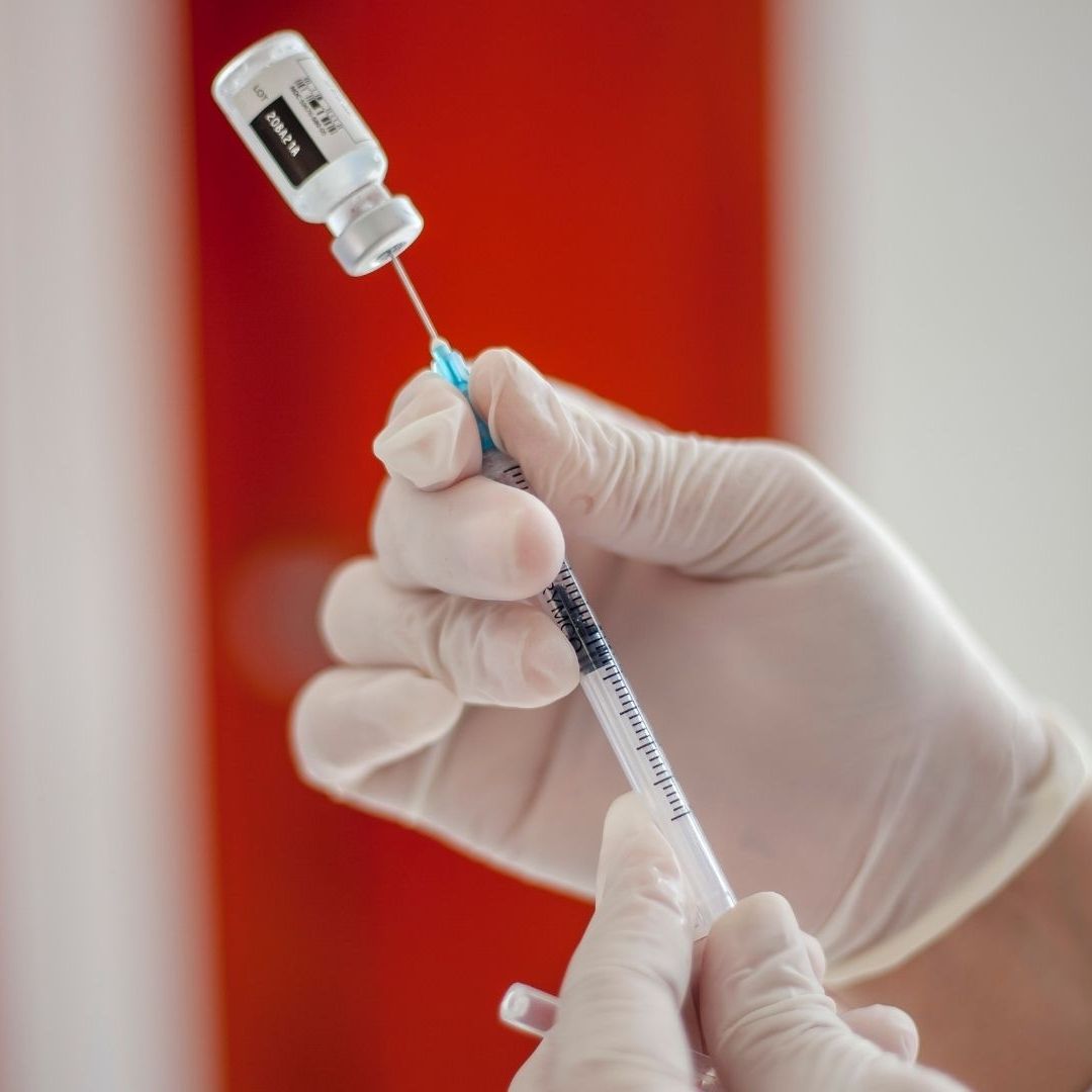 Close-Up Shot of a Vial on a Syringe
