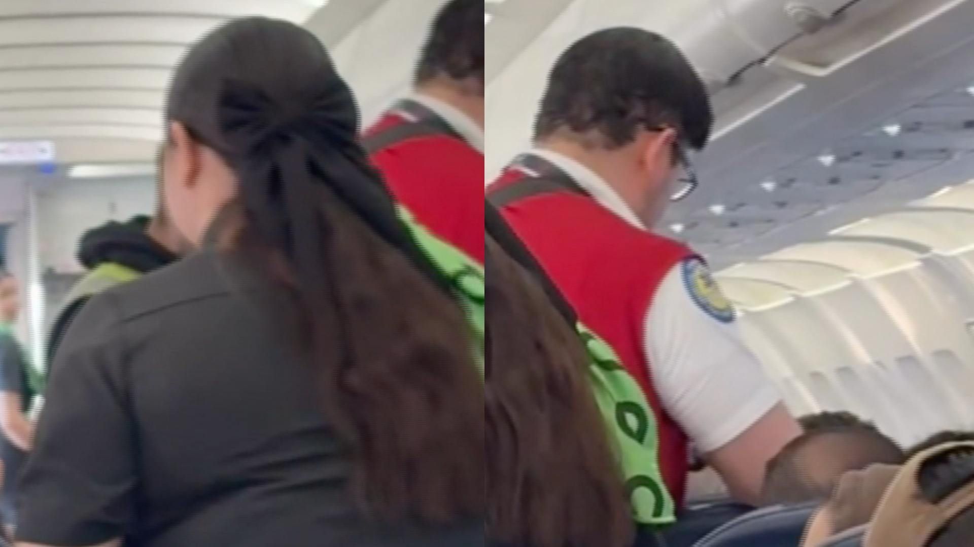 Tripulación atendiendo a hombre