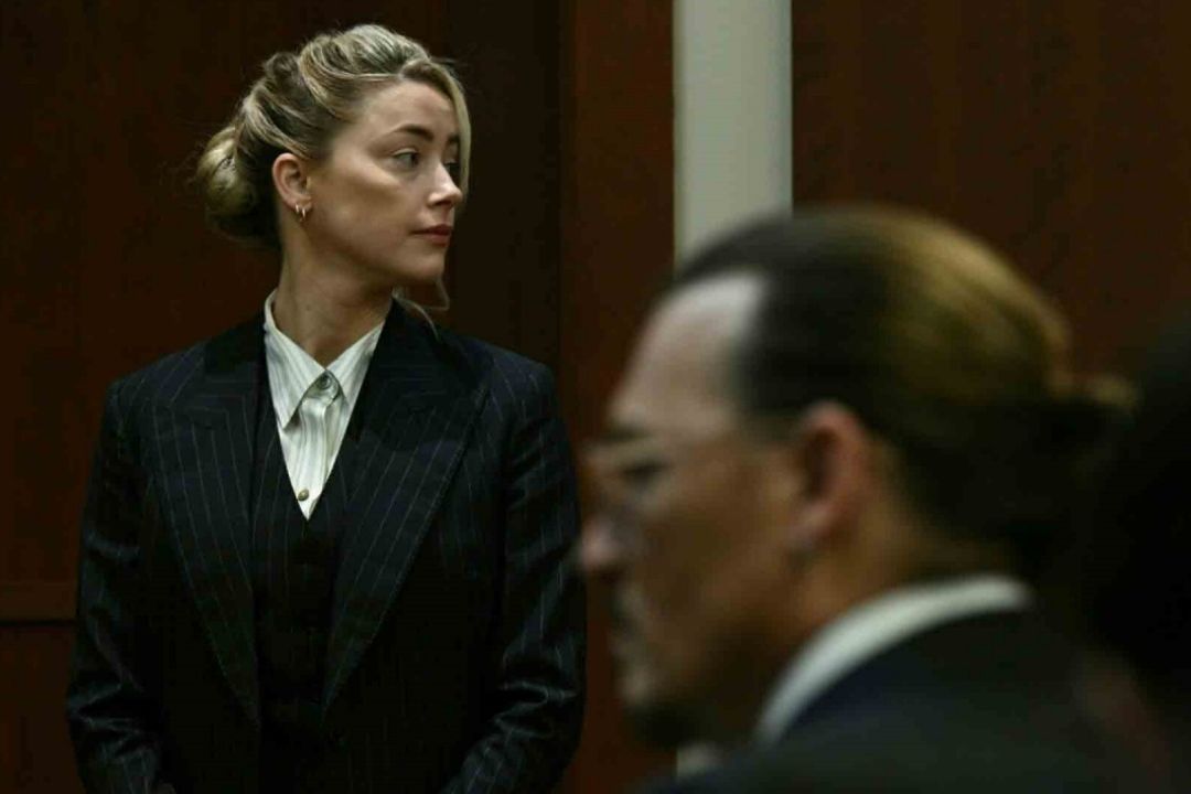 La actriz Amber Heard anunció que llegó un acuerdo con su exesposo Johnny Depp