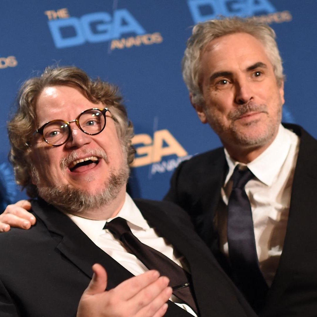 Guillermo del Toro y Alfonso Cuarón en una alfombra roja