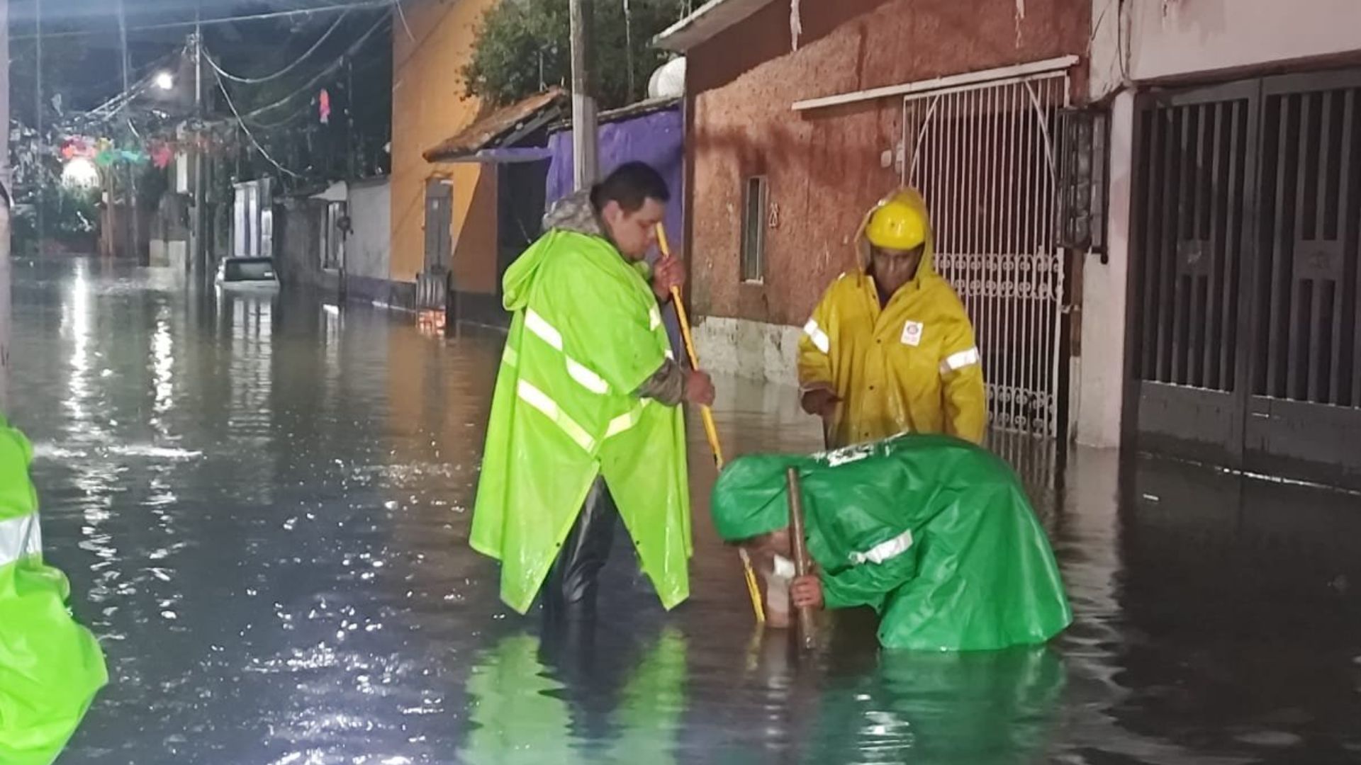 Firefighters respond to fallen trees and flooding as storms swept Mexico City on August 11